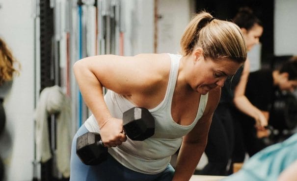 Woman training with weights